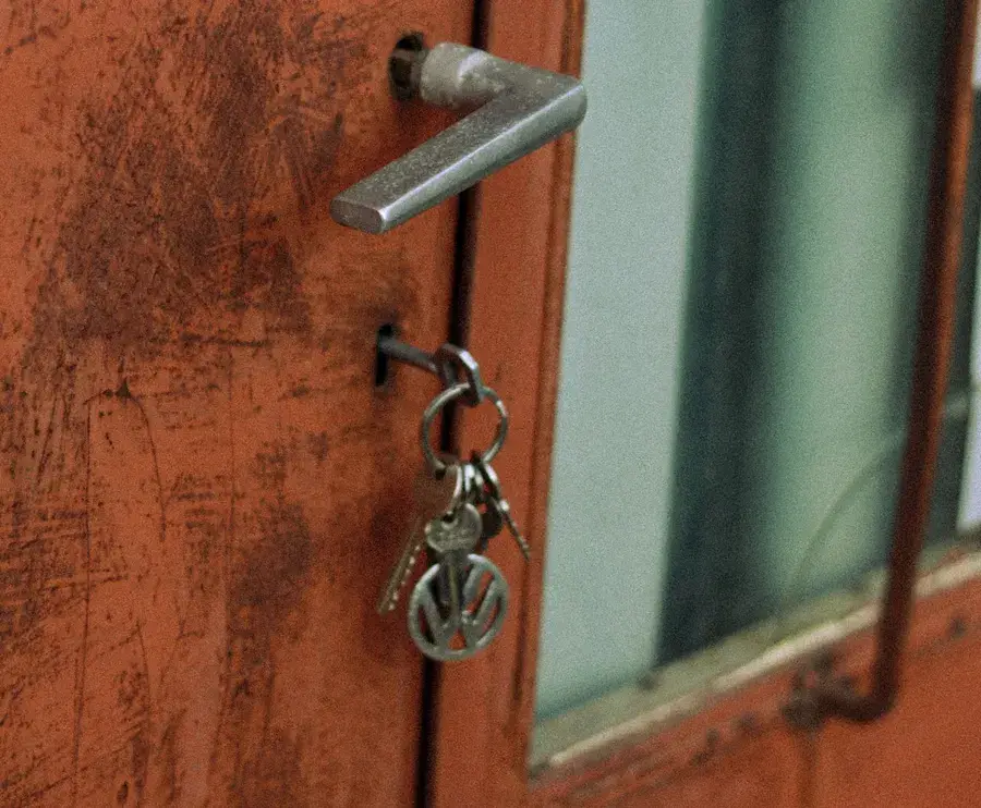 Keys hanging from the lock of an old door – why keys snap and when broken key removal Chester is needed, Locksmith Chester