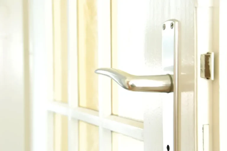 Lock repair or replacement in Chester – white door with a lever handle and locking plate, Locksmith Chester guide to which your door needs