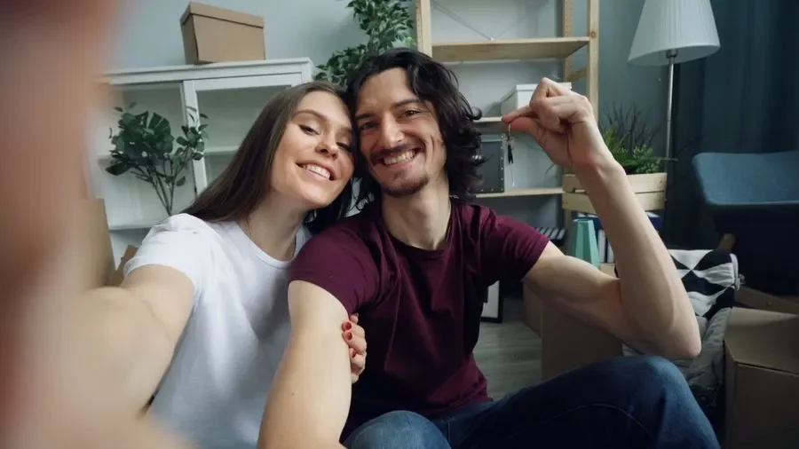 Couple holding up keys in their new home – residential locksmith Chester help for homeowners from Locksmith Chester