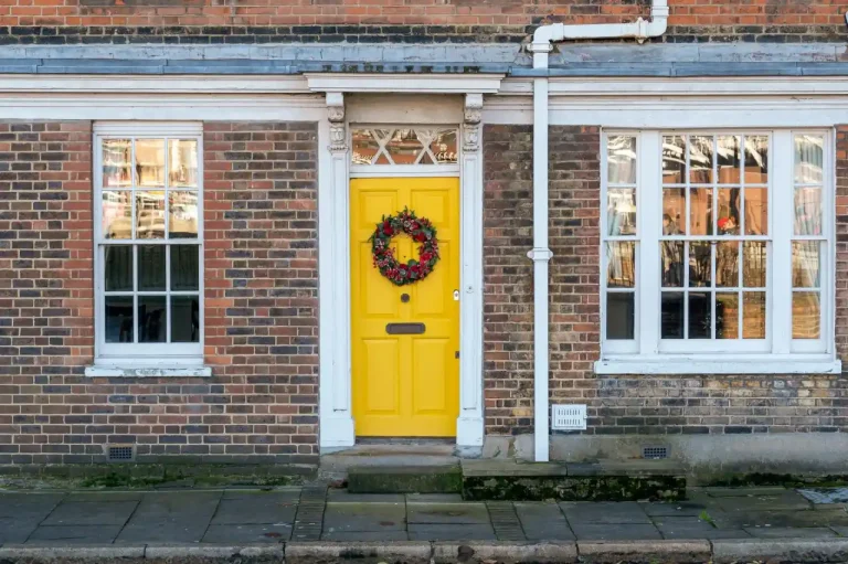 Types of door locks in the UK – yellow front door on a red-brick Victorian house in Chester, Locksmith Chester guide to identifying your lock